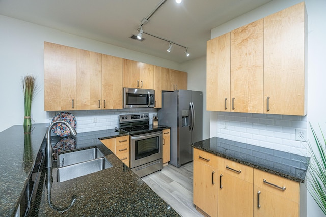 401 S Elgin Ct Unit 401, Charleston, SC 29414 - kitchen with appliances with stainless steel finishes, a sink, dark stone counters, backsplash, and light wood-type flooring