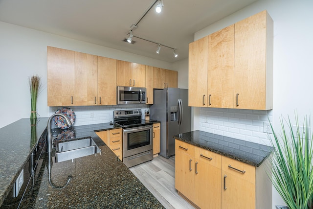 401 S Elgin Ct Unit 401, Charleston, SC 29414 - kitchen featuring appliances with stainless steel finishes, a sink, dark stone counters, and tasteful backsplash