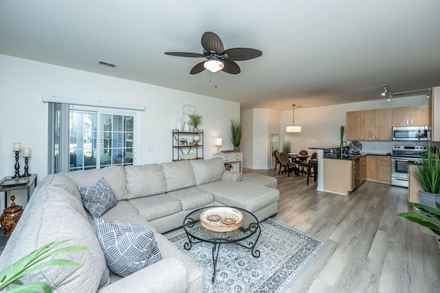 401 S Elgin Ct Unit 401, Charleston, SC 29414 - living area featuring light wood finished floors and a ceiling fan