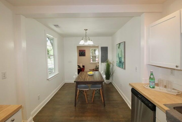 dining area featuring beam ceiling, dark hardwood / wood-style floors, and a notable chandelier