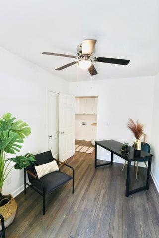 living area with dark hardwood / wood-style flooring