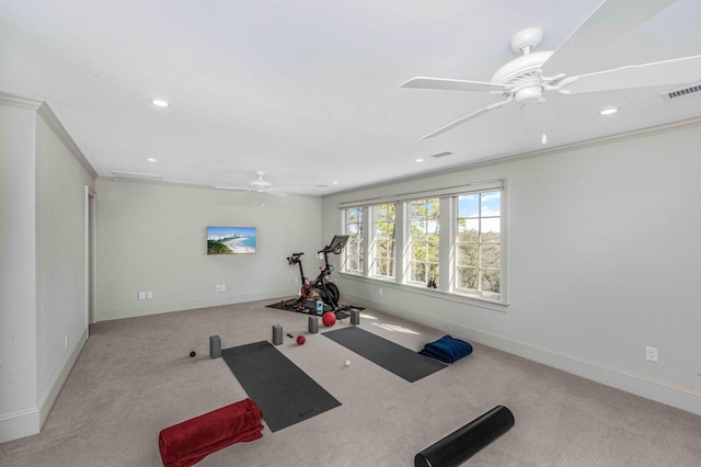 exercise area featuring baseboards, visible vents, carpet floors, recessed lighting, and ornamental molding