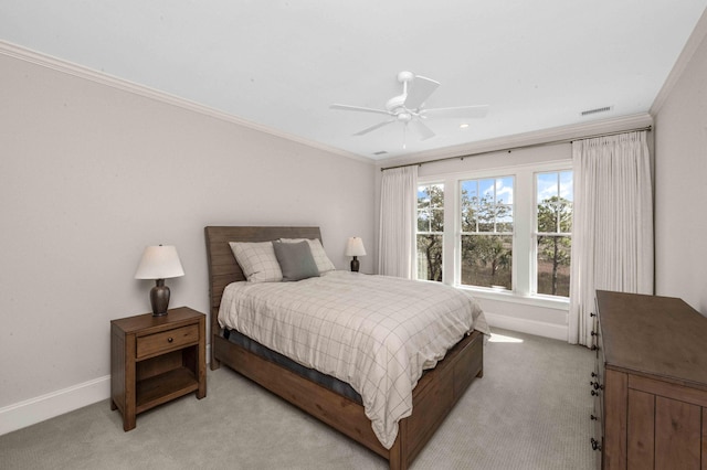 bedroom featuring a ceiling fan, light colored carpet, baseboards, and ornamental molding