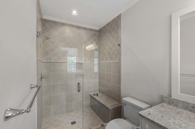 full bath with vanity, a shower stall, toilet, and ornamental molding