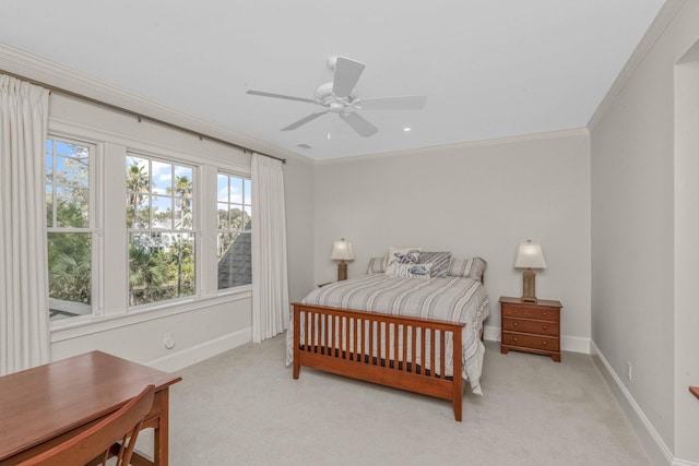 bedroom with ornamental molding, a ceiling fan, baseboards, and light carpet