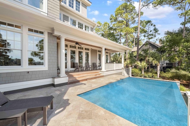 view of pool with a patio area, french doors, and ceiling fan