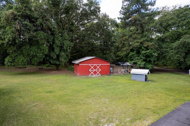 225 Baxter Ln, Walterboro, SC 29488 - view of green lawn with a storage unit and an outdoor structure