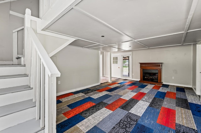 225 Baxter Ln, Walterboro, SC 29488 - unfurnished living room featuring stairway, a glass covered fireplace, and baseboards