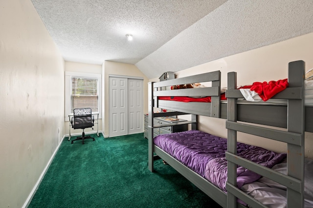 225 Baxter Ln, Walterboro, SC 29488 - carpeted bedroom featuring a textured ceiling, vaulted ceiling, baseboards, and a closet