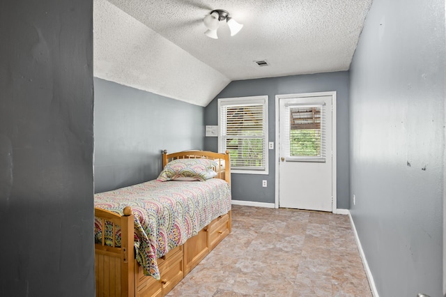 225 Baxter Ln, Walterboro, SC 29488 - bedroom with a textured ceiling, baseboards, and lofted ceiling