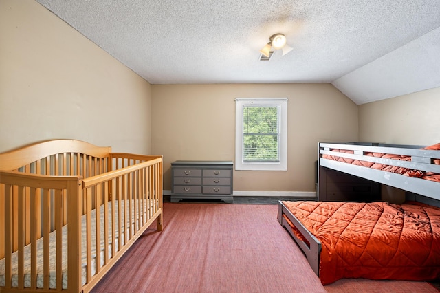 225 Baxter Ln, Walterboro, SC 29488 - bedroom with vaulted ceiling, a textured ceiling, and baseboards