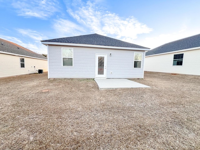 back of house with a patio area and central AC unit