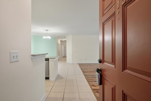 115 Golfview Ln, Summerville, SC 29485 - corridor with light tile patterned floors, a chandelier, and baseboards