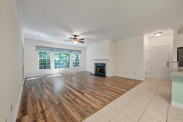 115 Golfview Ln, Summerville, SC 29485 - unfurnished living room with ceiling fan, a fireplace with flush hearth, light wood-style flooring, ornamental molding, and baseboards
