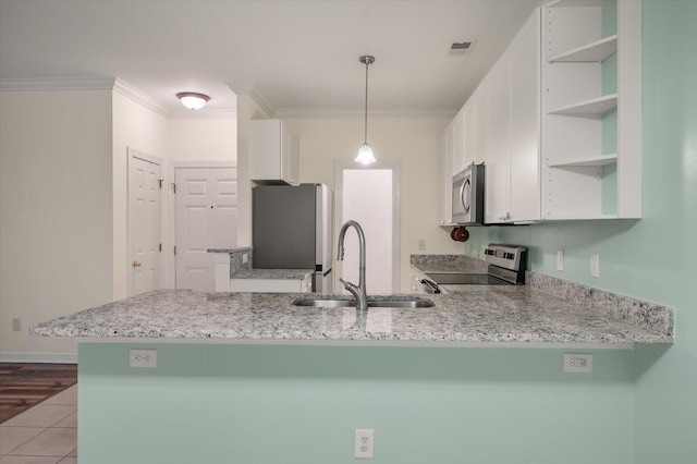 115 Golfview Ln, Summerville, SC 29485 - kitchen with open shelves, appliances with stainless steel finishes, a sink, a peninsula, and white cabinets