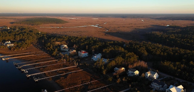 aerial view at dusk with a water view