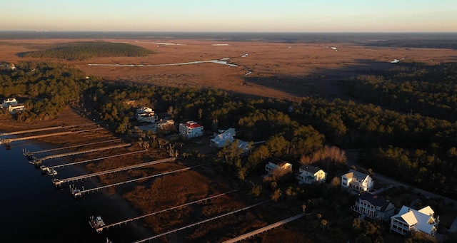 aerial view at dusk with a water view