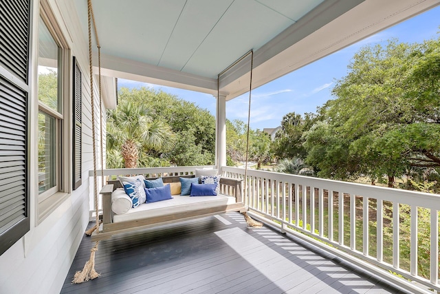 wooden terrace with outdoor lounge area