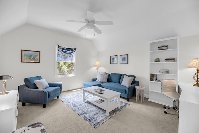 living room featuring light colored carpet, lofted ceiling, and ceiling fan