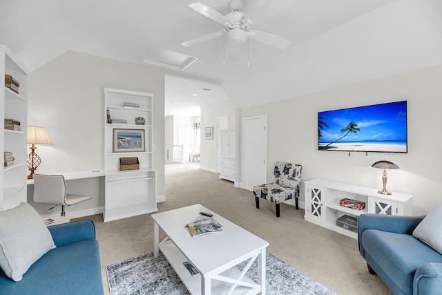 carpeted living area with attic access, a ceiling fan, an office area, and baseboards