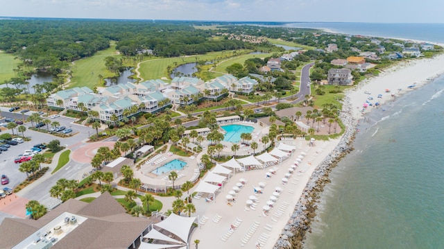 aerial overview of property's location with expansive coastline and a pool area