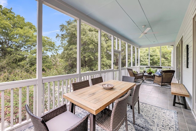 sunroom with a ceiling fan and outdoor lounge area