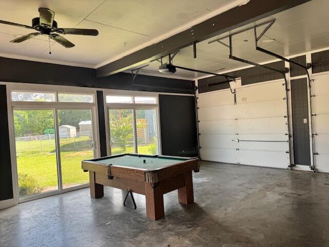 1129 Levi St, Manning, SC 29102 - garage with a garage door opener and ceiling fan