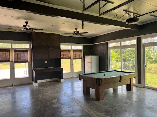 1129 Levi St, Manning, SC 29102 - playroom featuring healthy amount of natural light, french doors, concrete flooring, billiards table, and beamed ceiling
