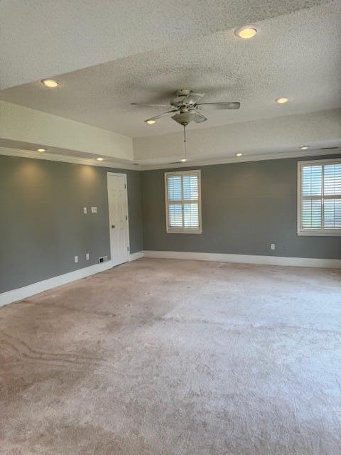 1129 Levi St, Manning, SC 29102 - empty room with light carpet, baseboards, a textured ceiling, recessed lighting, and a ceiling fan