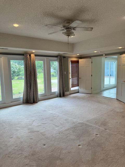 1129 Levi St, Manning, SC 29102 - spare room featuring light carpet, a textured ceiling, healthy amount of natural light, ceiling fan, and recessed lighting