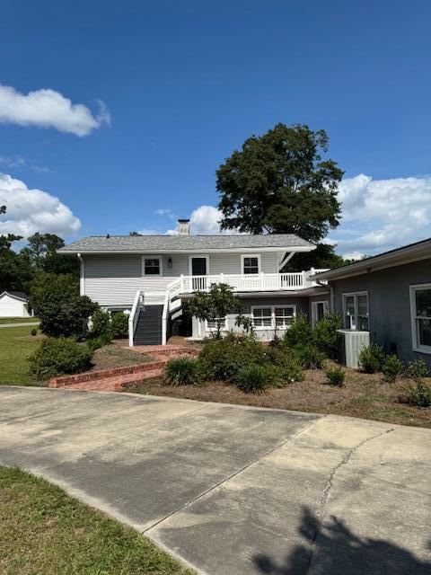 1129 Levi St, Manning, SC 29102 - view of front of property featuring stairway and central air condition unit