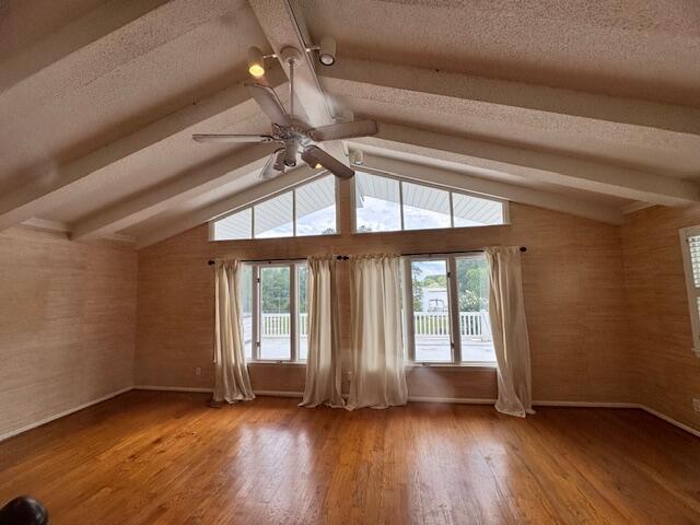 1129 Levi St, Manning, SC 29102 - unfurnished living room with ceiling fan, baseboards, wood finished floors, and a textured ceiling