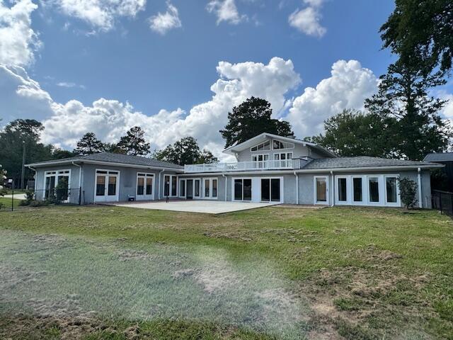 1129 Levi St, Manning, SC 29102 - rear view of property featuring a lawn and a patio area