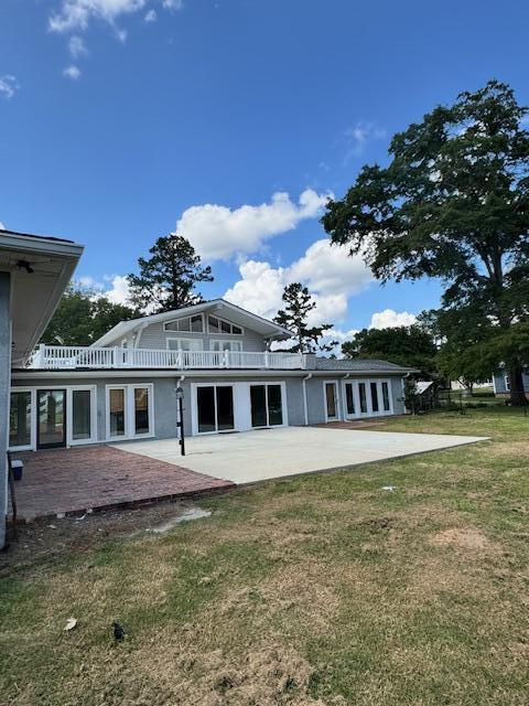 1129 Levi St, Manning, SC 29102 - rear view of property with a patio and a lawn