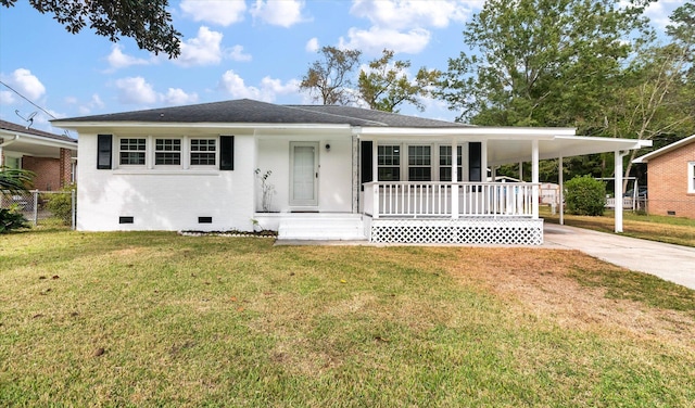 view of front of home featuring a front yard, a carport, and a porch