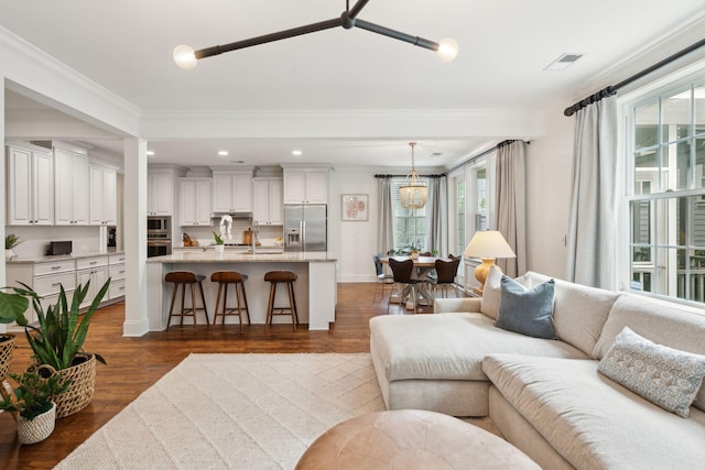 1407 Wando View St, Daniel Island, SC 29492 - living room with dark wood finished floors, recessed lighting, and crown molding