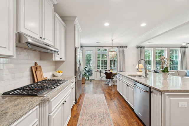1407 Wando View St, Daniel Island, SC 29492 - kitchen featuring appliances with stainless steel finishes, under cabinet range hood, dark wood-type flooring, white cabinetry, and recessed lighting
