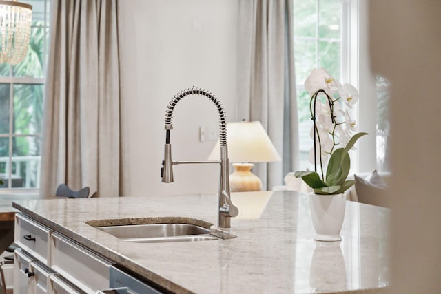 1407 Wando View St, Daniel Island, SC 29492 - kitchen view of a sink and light stone countertops
