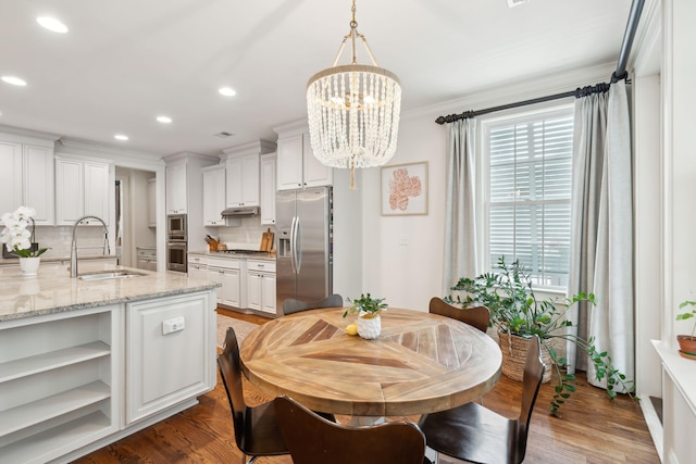 1407 Wando View St, Daniel Island, SC 29492 - dining room with a chandelier, recessed lighting, ornamental molding, and wood finished floors