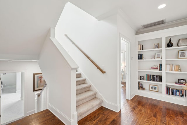 1407 Wando View St, Daniel Island, SC 29492 - stairs featuring wood finished floors, built in shelves, and ornamental molding