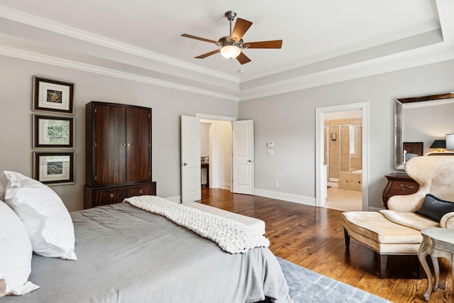 1407 Wando View St, Daniel Island, SC 29492 - bedroom with wood finished floors, a tray ceiling, crown molding, a ceiling fan, and ensuite bathroom