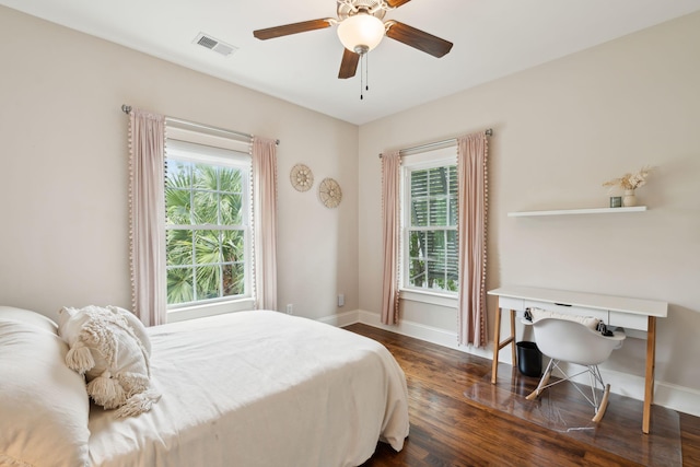 1407 Wando View St, Daniel Island, SC 29492 - bedroom with multiple windows, wood finished floors, and a ceiling fan