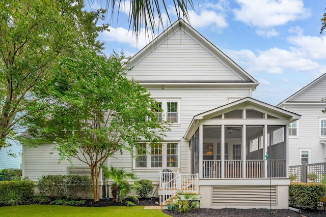 1407 Wando View St, Daniel Island, SC 29492 - back of property featuring a sunroom and a yard