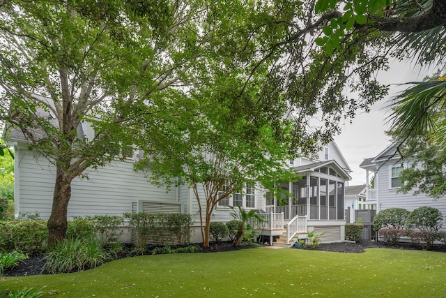 1407 Wando View St, Daniel Island, SC 29492 - back of property with a sunroom and a lawn