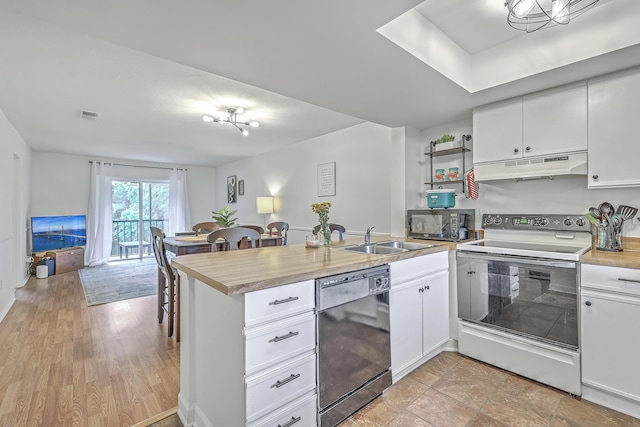 2174 Bees Ferry Rd Unit G, Charleston, SC 29414 - kitchen featuring black appliances, under cabinet range hood, a peninsula, light countertops, and white cabinets