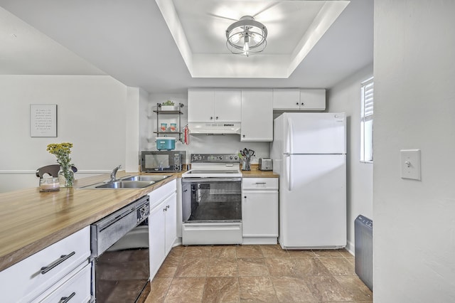 2174 Bees Ferry Rd Unit G, Charleston, SC 29414 - kitchen featuring black appliances, white cabinetry, under cabinet range hood, and a raised ceiling