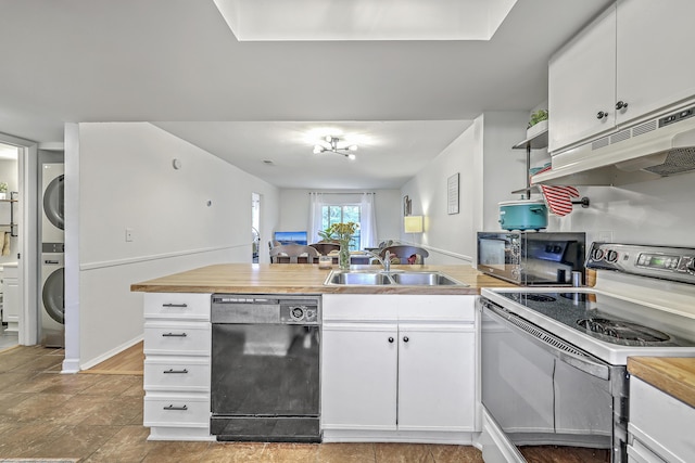 2174 Bees Ferry Rd Unit G, Charleston, SC 29414 - kitchen featuring black appliances, stacked washer / dryer, under cabinet range hood, a peninsula, and white cabinets