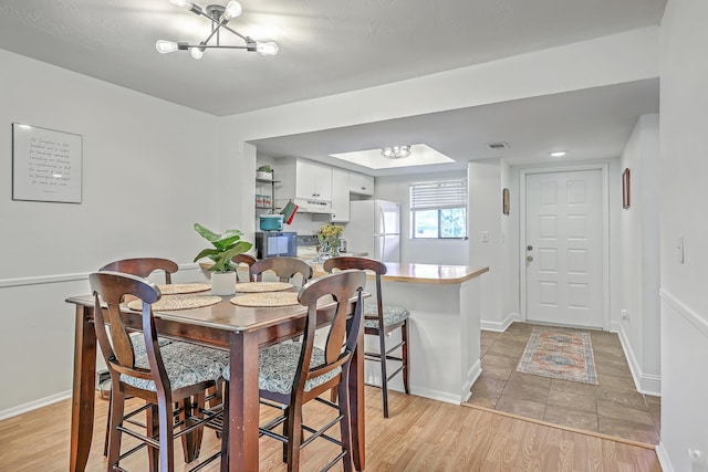 2174 Bees Ferry Rd Unit G, Charleston, SC 29414 - dining area featuring a chandelier and light wood finished floors
