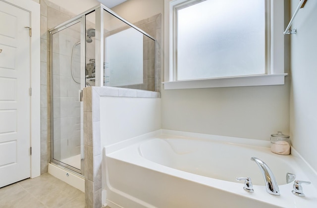 full bathroom with a garden tub and a shower stall