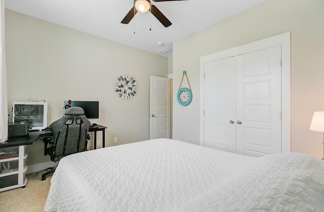 bedroom with a closet, ceiling fan, and carpet floors